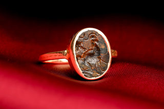 Gold signet ring set with an Ancient Roman jasper intaglio of Triton