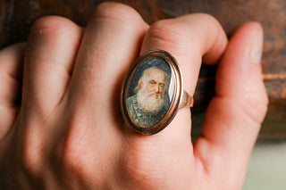 Portrait miniature ring on the finger for scale