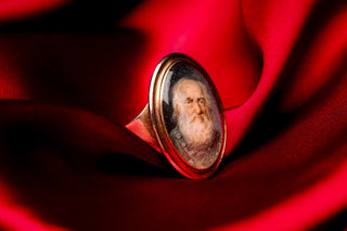 Georgian mourning ring on red silk
