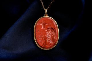 Antique red glass intaglio pendant in 18K gold, laureate bust with Greek letters