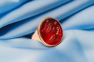 Georgian Tassie intaglio signet ring on blue silk