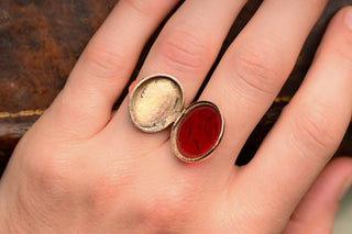 Secret compartment ring open on the hand