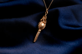 Georgian watch key worn as a pendant on a gold chain